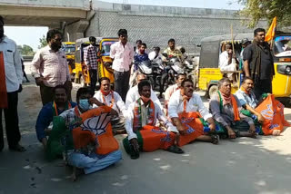 bjp and janasena followers protest at nandigama to repair roads