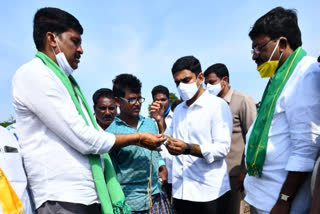 Inspecting crop damaged due to cyclone ..