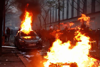 Fires could be seen on the streets in Paris on Saturday as thousands protested