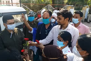 fired health workers offered flowers to officials