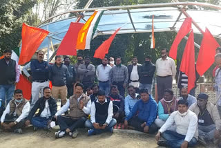 Employees protest outside the factory