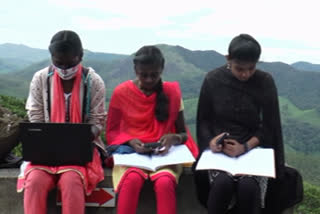 Girls walk 6 km from home in search of internet connectivity to attend online classes every day   Students at Rajamala, Idukki, turn crash barriers along the roads their study area