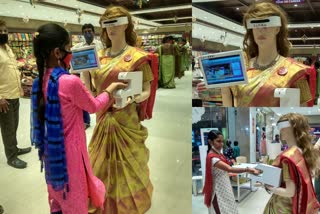 covid safety robo in clothing store at guntur  ‌ റോബോർട്ട്‌  covid safety