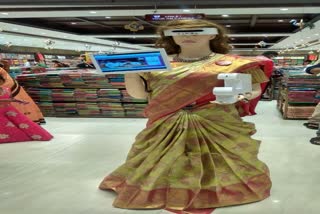 covid safety robo in  clothing store at guntur