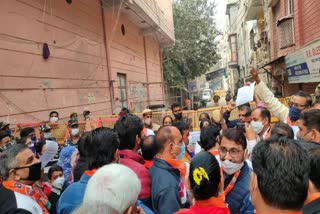 bjp protest outside aap mla office in deoli delhi