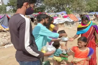 Malleshwar Rao distributes food among poor people