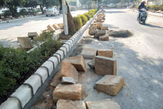 New stones are being put in dividers for security and attractiveness in Dwarka