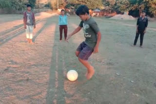 Players playing football without shoes