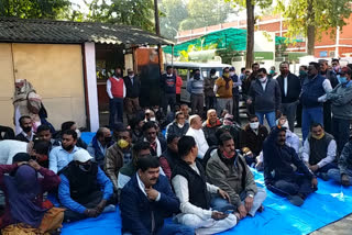 Employees sitting on dharna