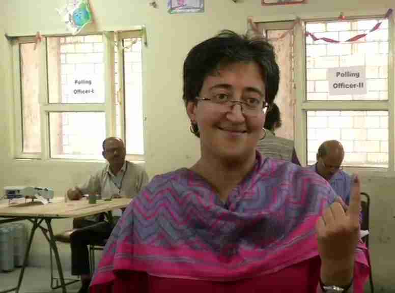 Atishi shows her inked finger