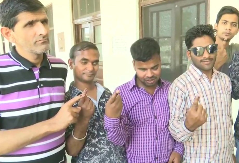 Visually-impaired voters cast their votes