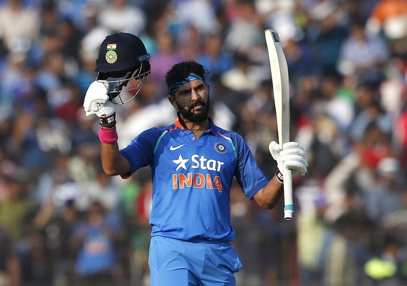 Yuvraj Singh raises his bat after slamming a ton against England in 2017 at Cuttack.