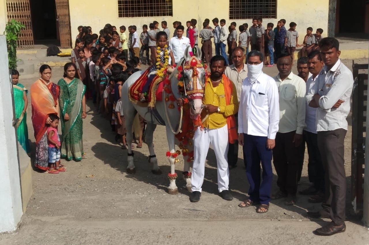 Teacher brought to students on horseback to school on the first day of school day