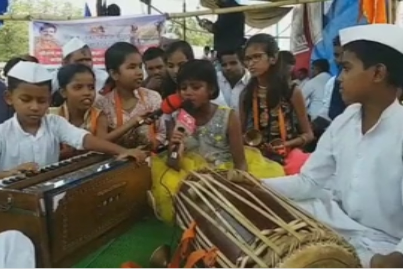 Students while doing 'bhajan-kirtan' andolan