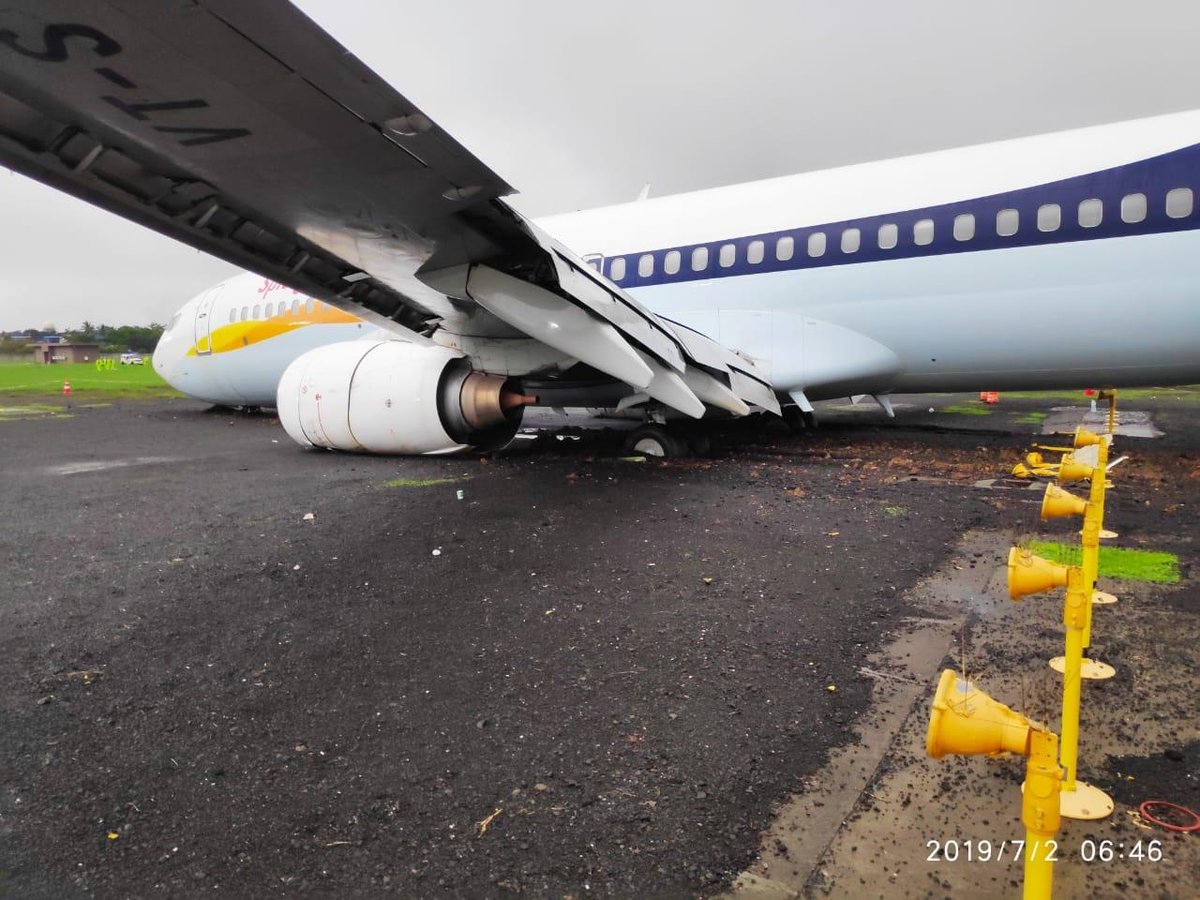 A  ramp being prepared to push the aircraft out of the grassy area