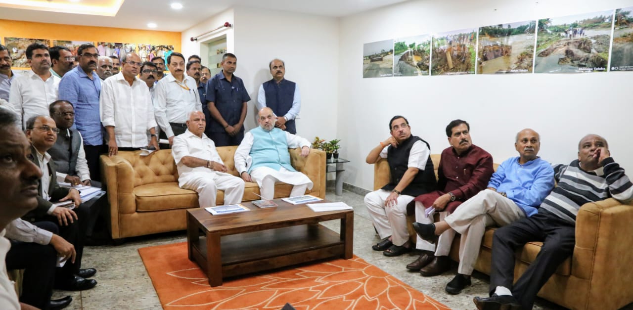 Amit Shah and Karnataka CM in a meeting after conducting an aerial survey