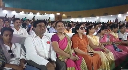 people in krishn memorial hall