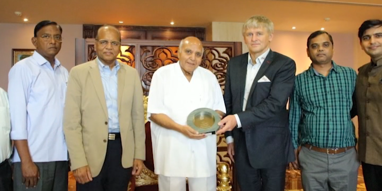 Aveco CEO Povel hands over the award to Chairman Ramoji Rao