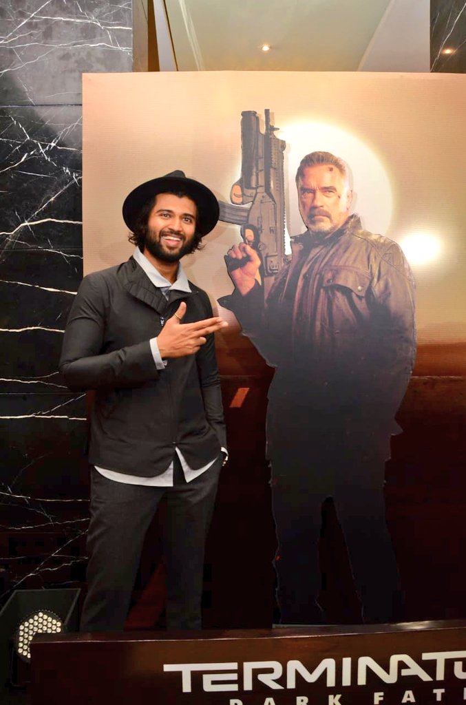 vijay deavarakonda with terminator cinema poster