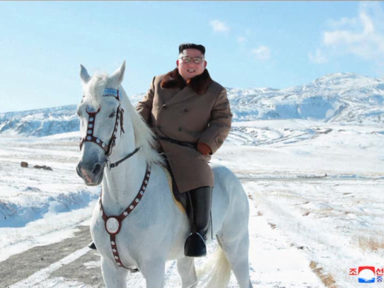 Kim rides horse to a sacred NKorean peak