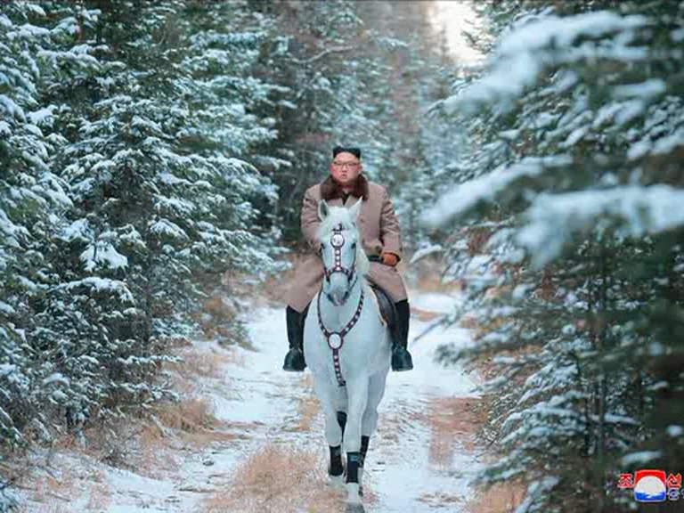 Kim rides horse to a sacred NKorean peak