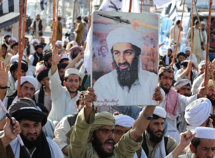Talibans holding Laden postures