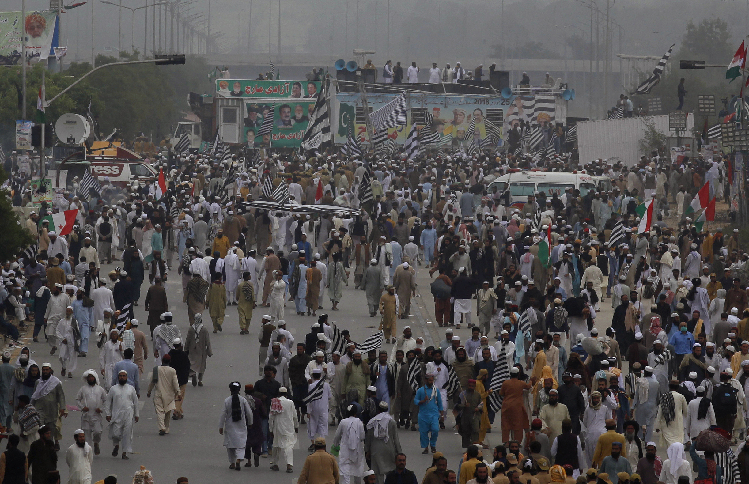 Supporters of a Pakistani radical Islamist party 'Jamiat Ulema-e-Islam', attend an anti-government march, in Islamabad