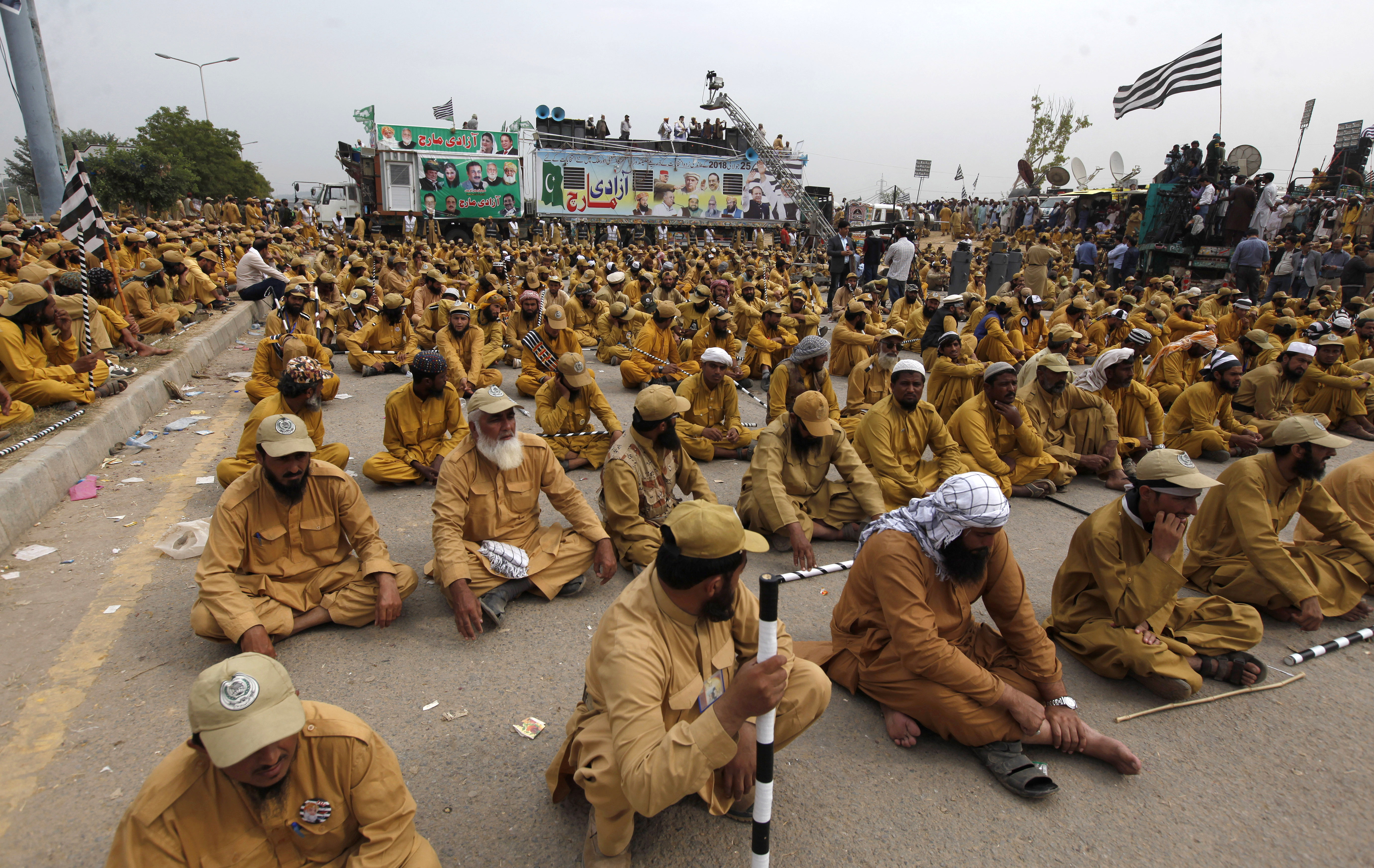 Supporters of a Pakistani radical Islamist party 'Jamiat Ulema-e-Islam', attend an anti-government march, in Islamabad