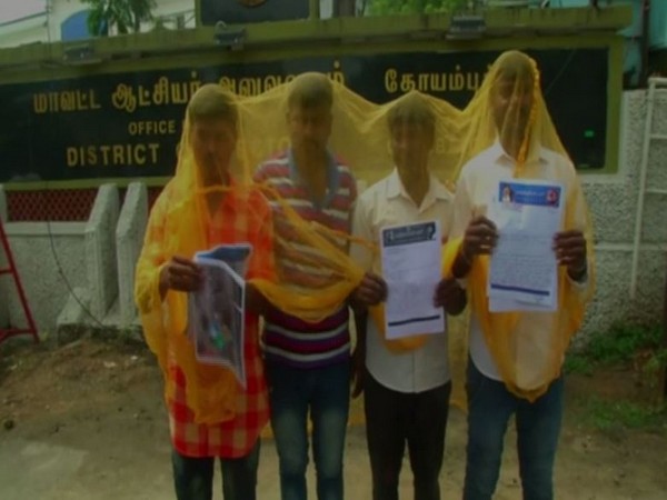 protest staged over dengue cases by wearing mosquito net