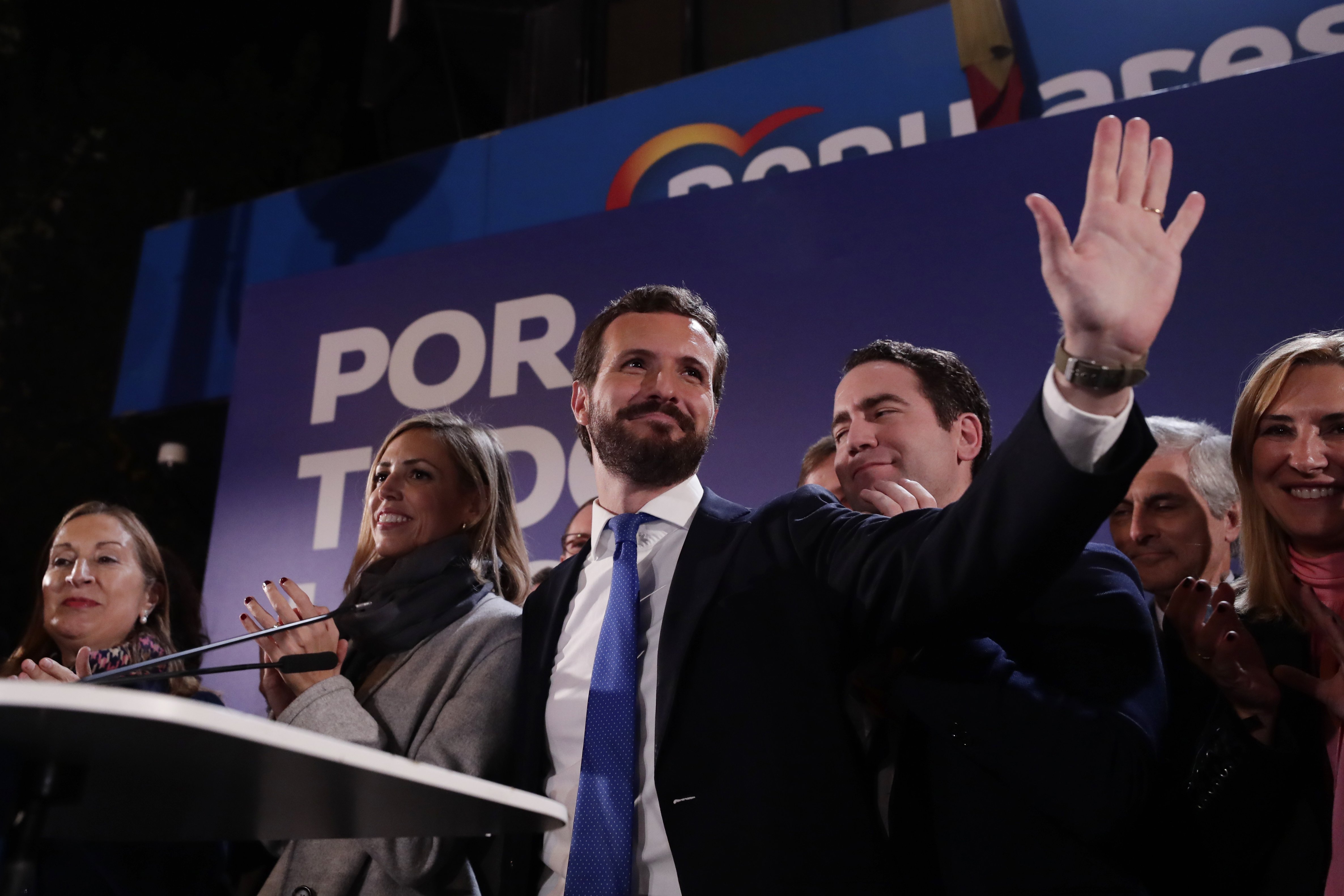 Santiago Abascal, leader of far-right Vox Party, waves to supporters as fireworks go off outside the party headquarters after the announcement of the general election first results in Madrid on Sunday.