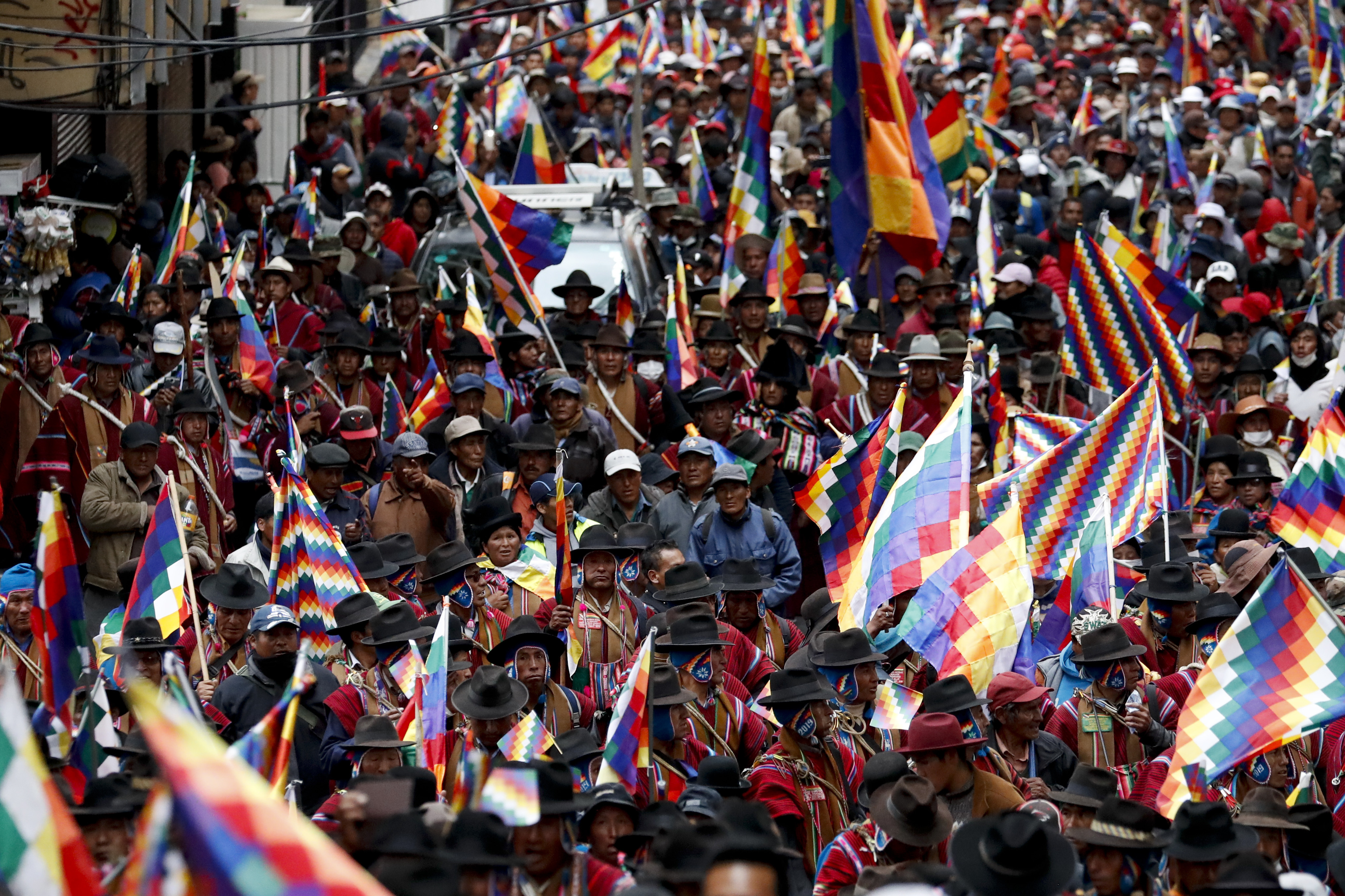 Backers of former President Evo Morales march in La Paz, Bolivia, on Thursday.