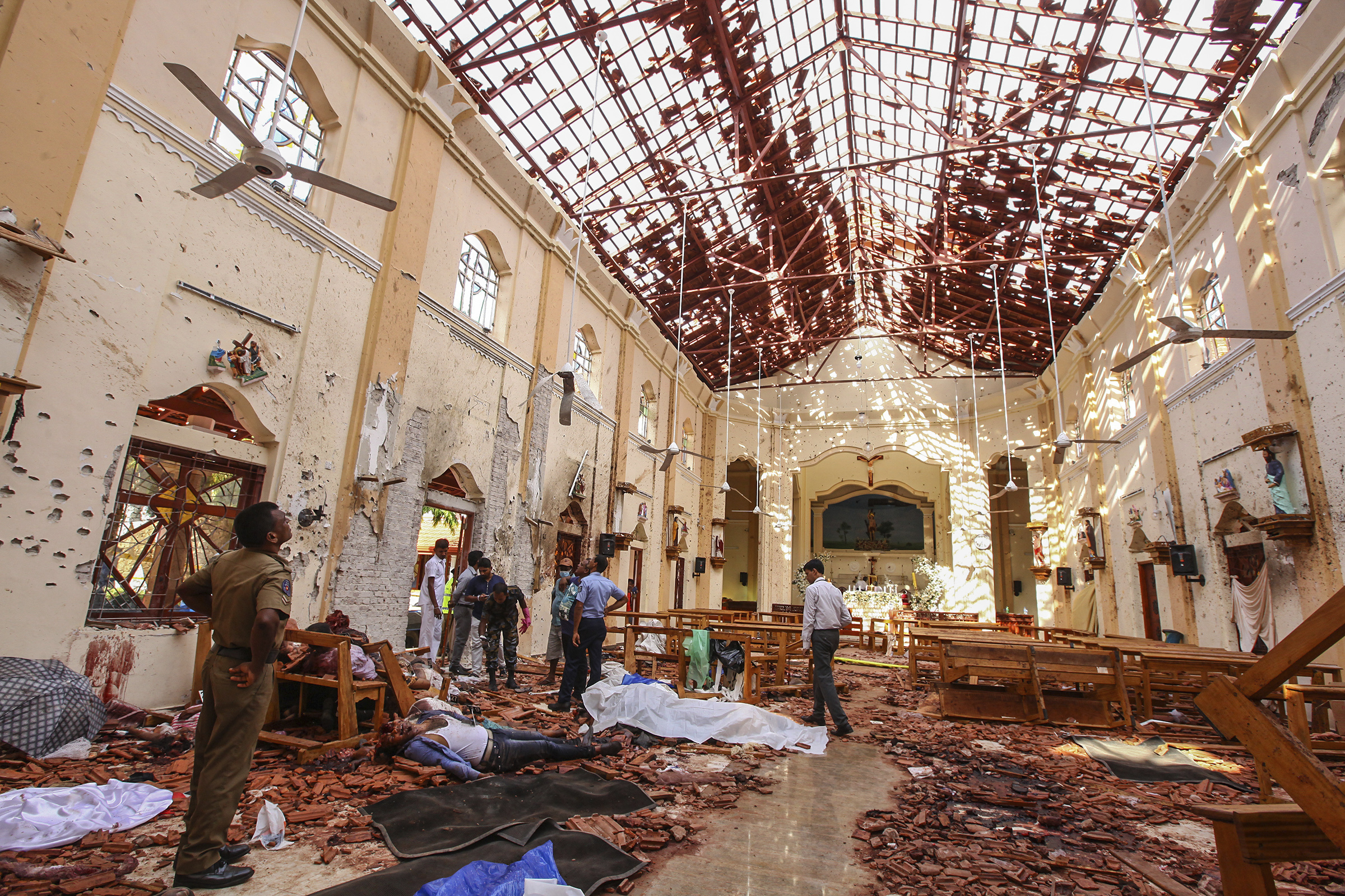 Dead bodies of victims lie inside St. Sebastian's Church damaged in a bomb blast in Negombo, north of Colombo.