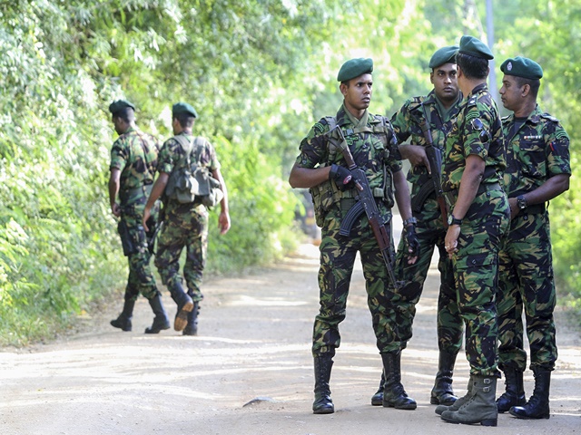 ecurity personnel patrol outside a polling station