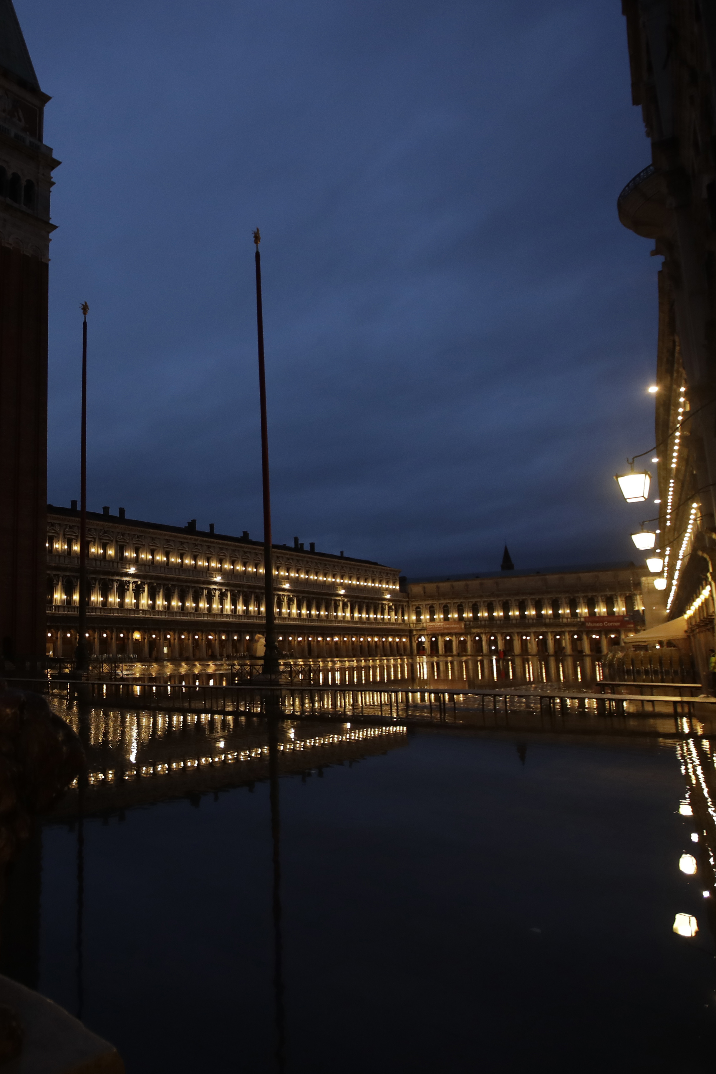 St. Mark square is reflected in flood water at dawn in Venice on Sunday.