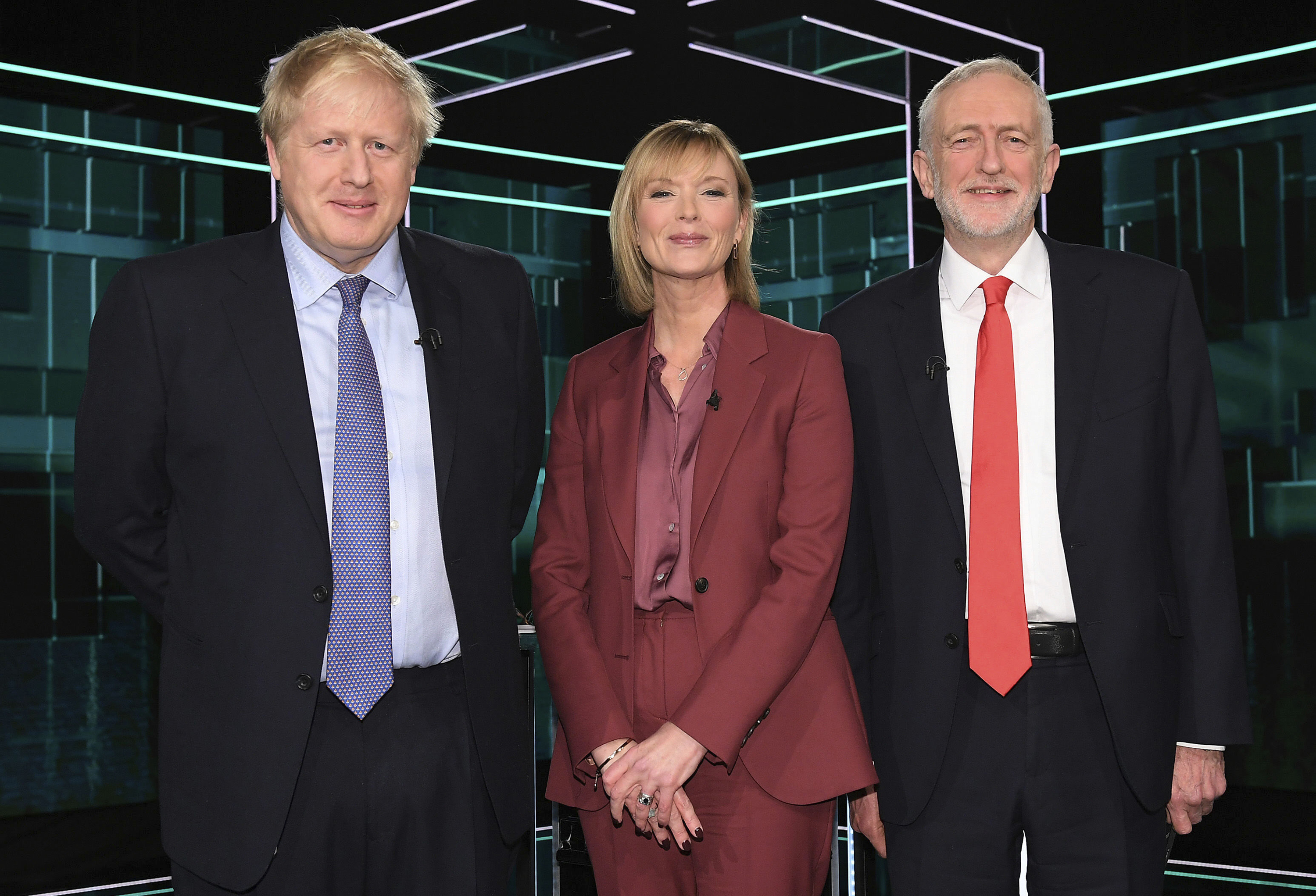 Boris Johnson and Jeremy Corbyn with TV debate adjudicator Julie Etchingham, prior to their election head-to-head debate live on TV in Manchester, England on Tuesday.