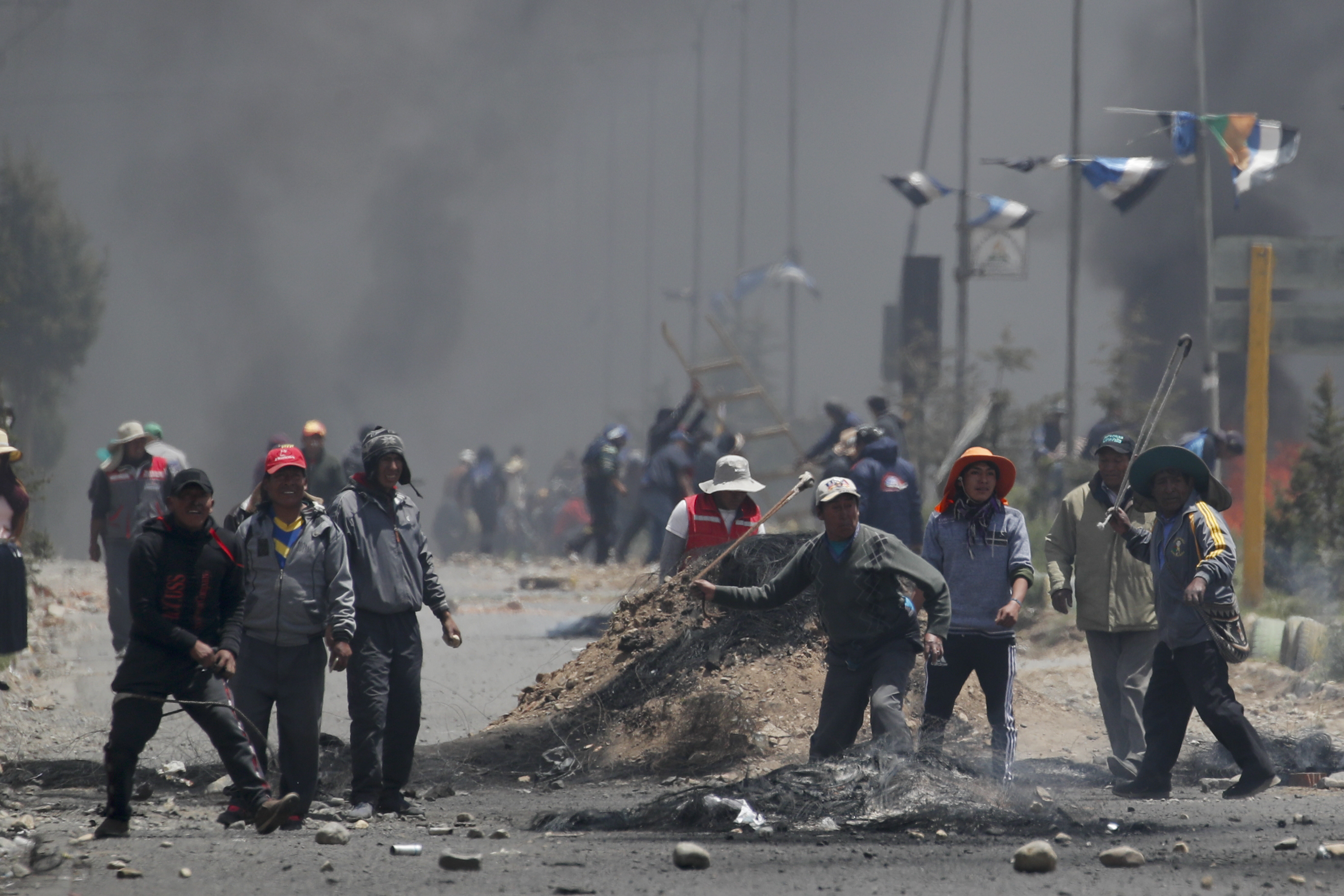 Supporters of former President Evo Morales clash with security forces in El Alto on the outskirts of La Paz, Bolivia on Tuesday.