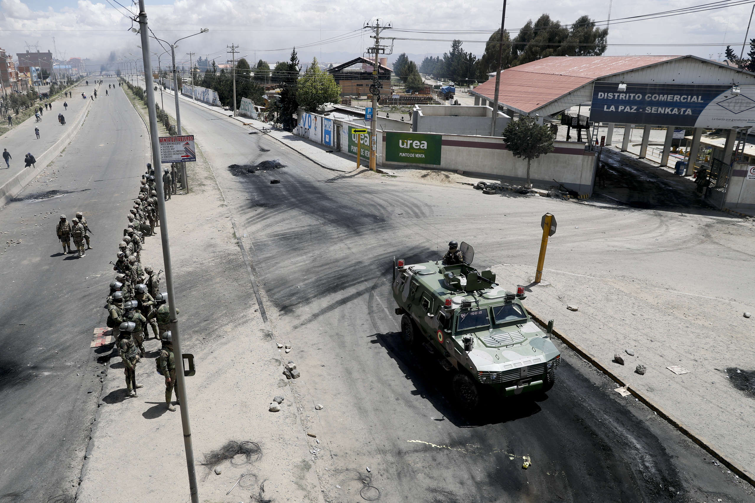 Security forces guard the state-own Senkata filling gas plant in El Alto, on the outskirts of La Paz, Bolivia on Tuesday.