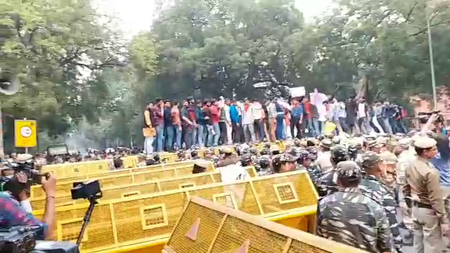 JNU protest Students stand on barricading slogans on sansad Marg