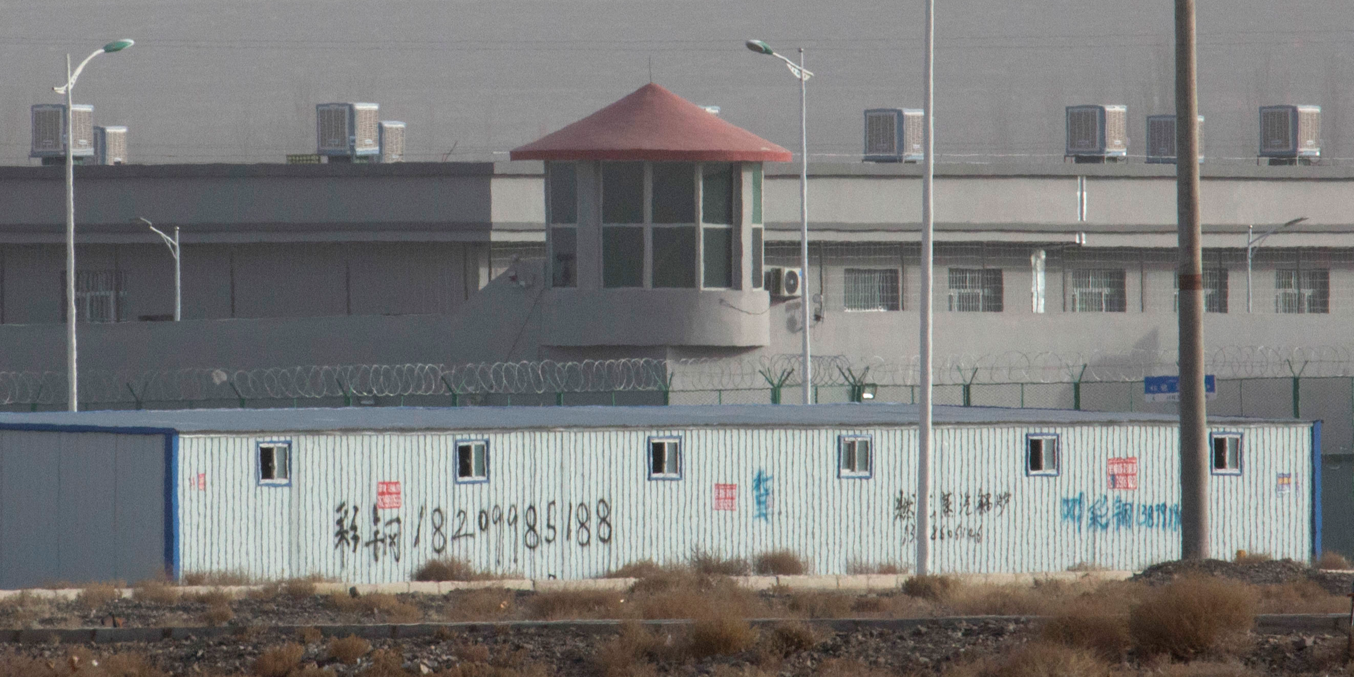 File photo: A guard tower and barbed wire fences are seen around a section of the Artux City Vocational Skills Education Training Service Center in Artux in western China's Xinjiang region.