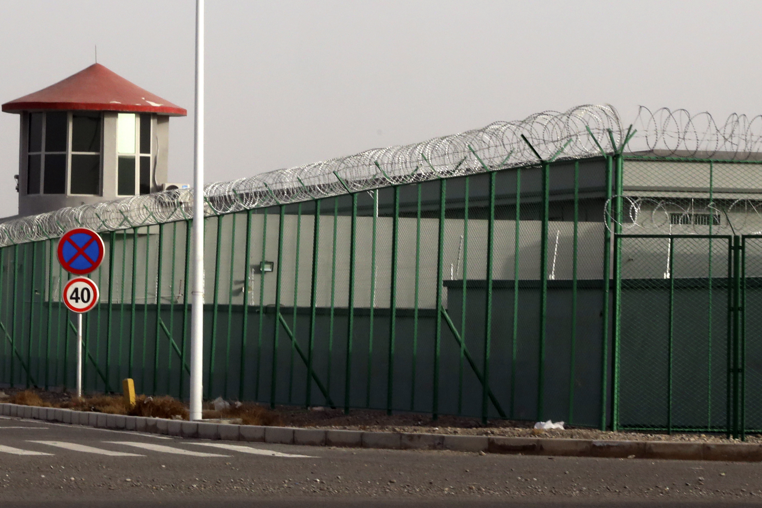 File photo: A guard tower and barbed wire fences are seen around a facility in the Kunshan Industrial Park in Artux in western China's Xinjiang region. This is one of a growing number of internment camps in the Xinjiang region.