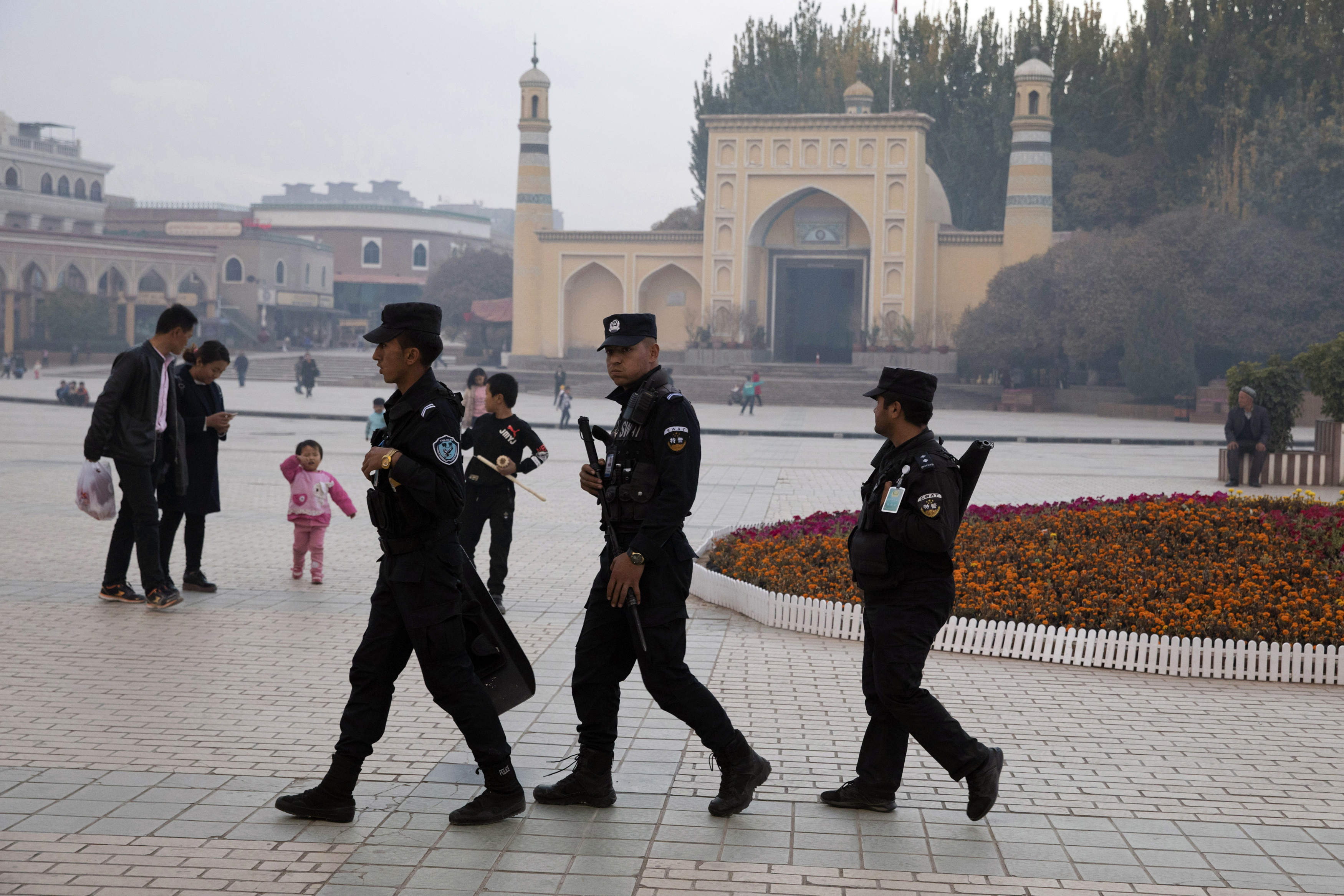 File photo: Uighur security personnel patrol near the Id Kah Mosque in Kashgar in western China's Xinjiang region.