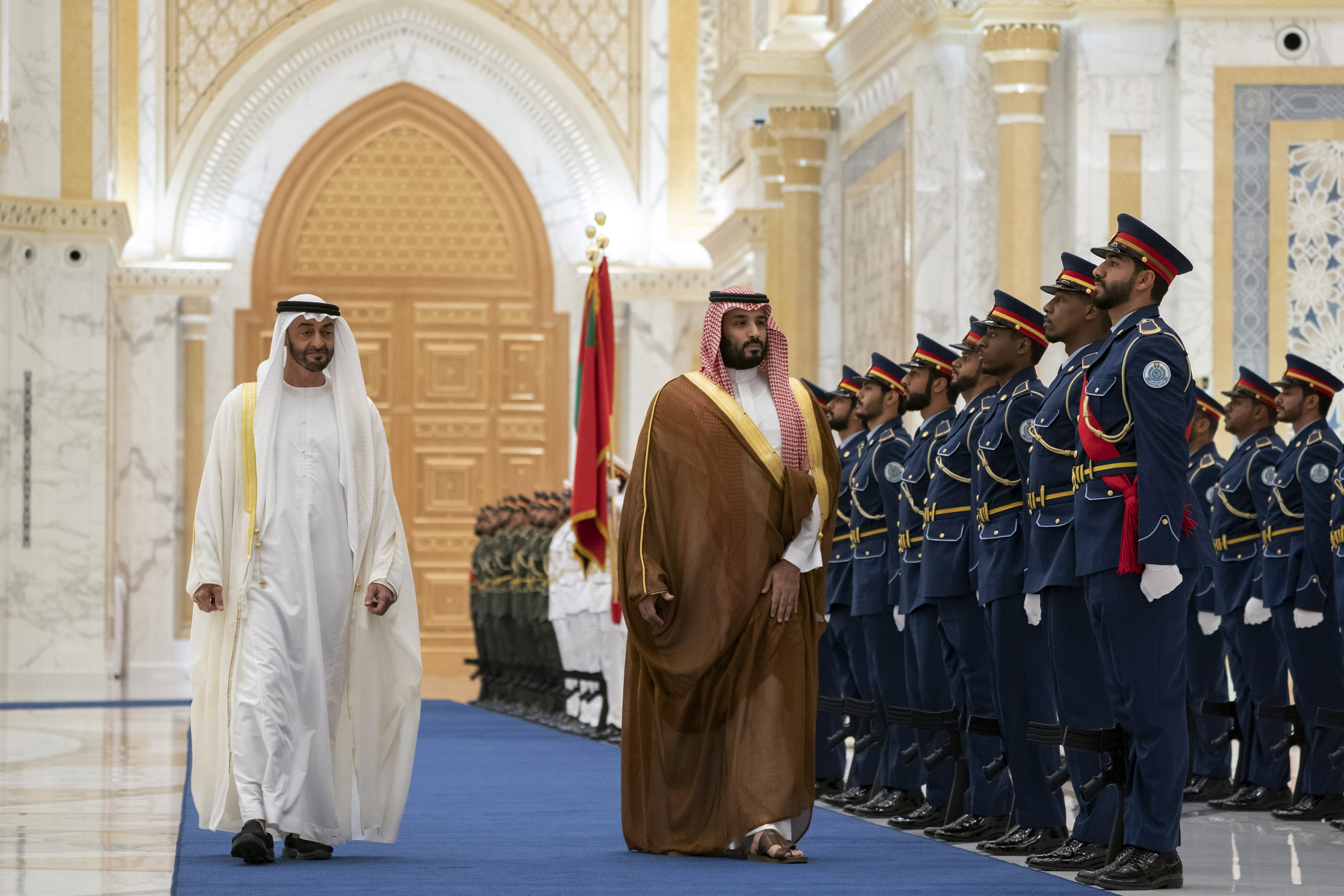 Saudi Crown Prince Mohammed bin Salman, right, inspects the guard of honor next to Abu Dhabi Crown Prince Mohammed bin Zayed Al Nahyan at Qasr Al Watan in Abu Dhabi