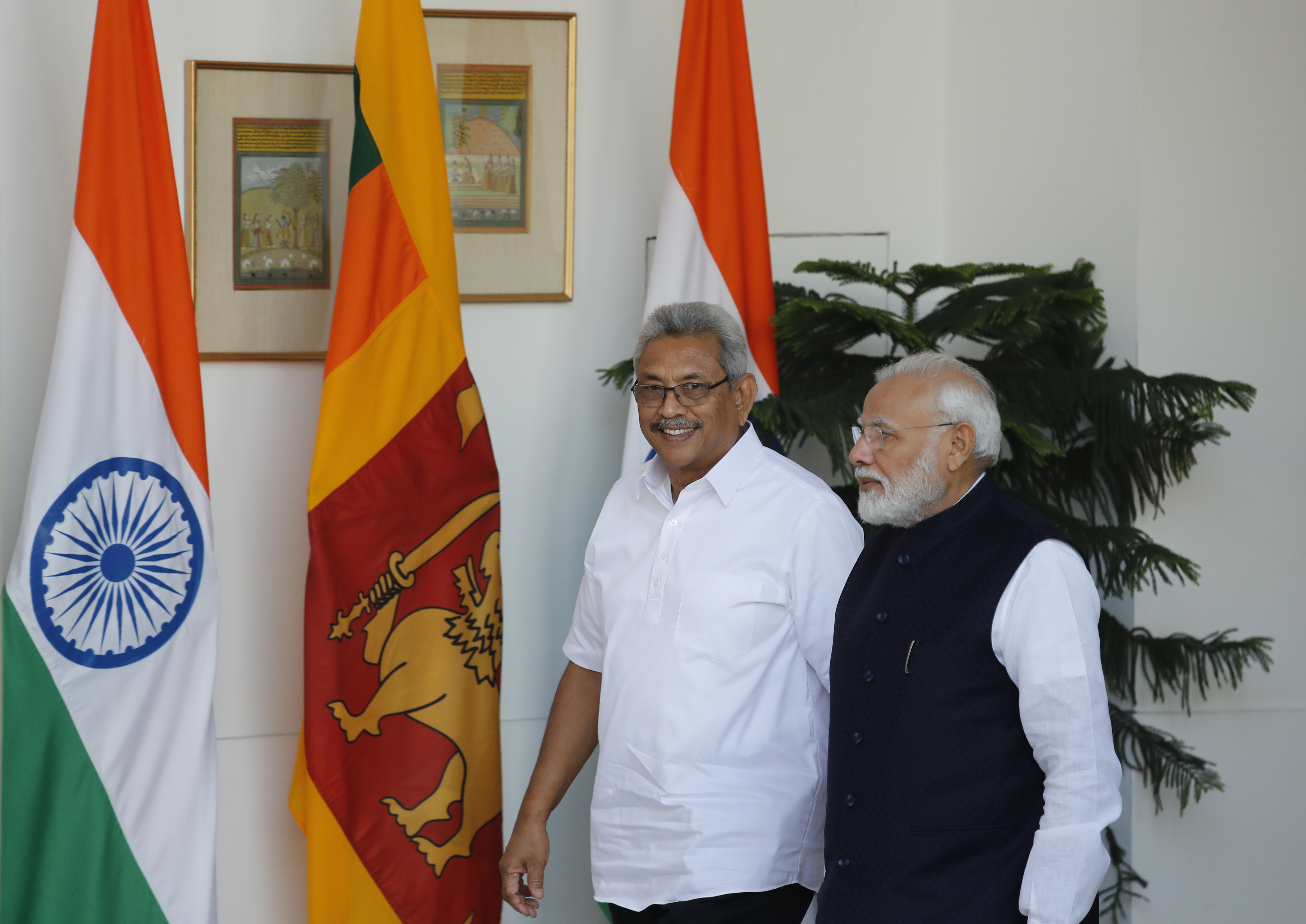 Indian Prime Minister Narendra Modi, right, walks with Sri Lankan President Gotabaya Rajapaksa before their delegation level talks in New Delhi, on Friday.