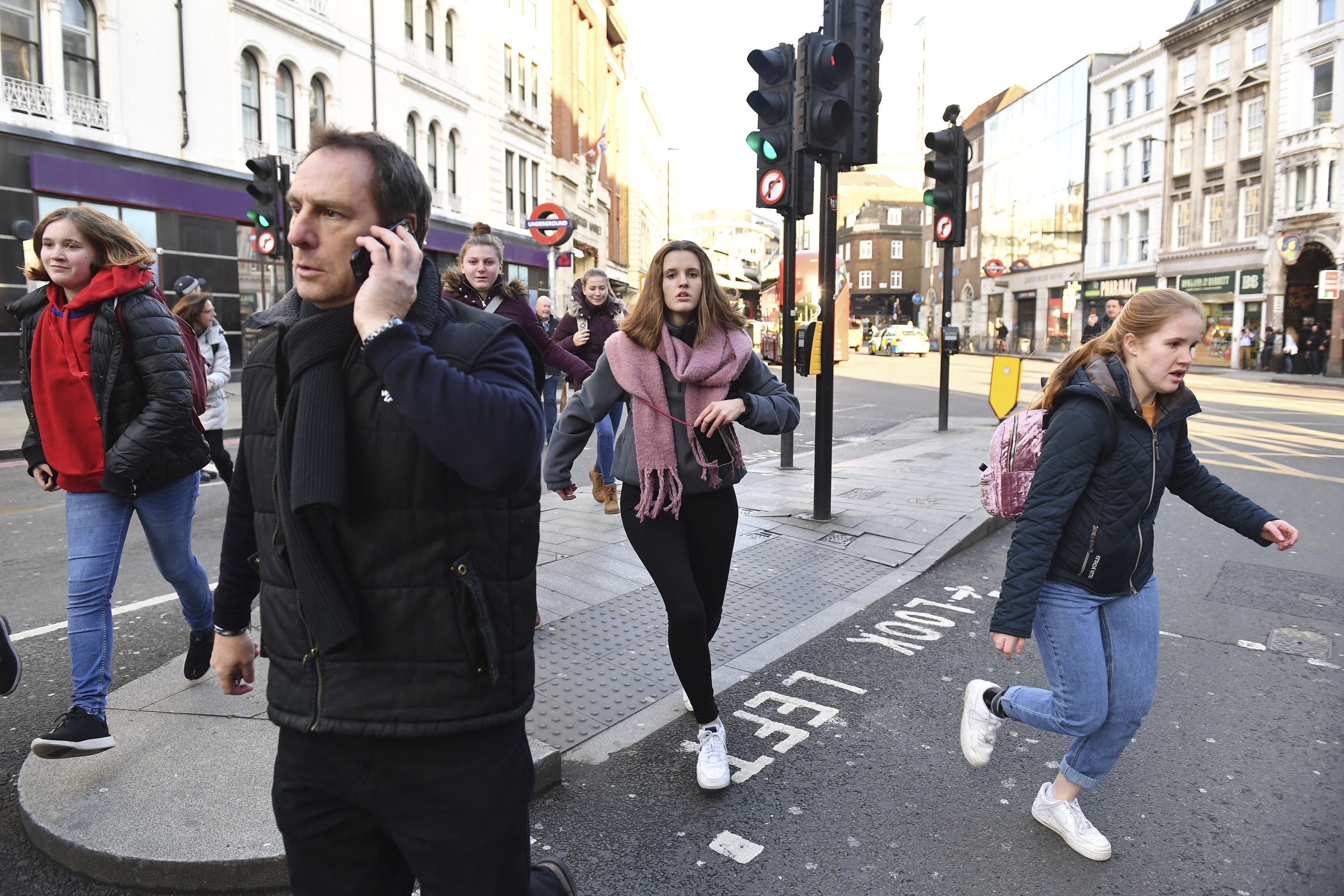 People are evacuated from London Bridge in central London following a police incident, on Friday.