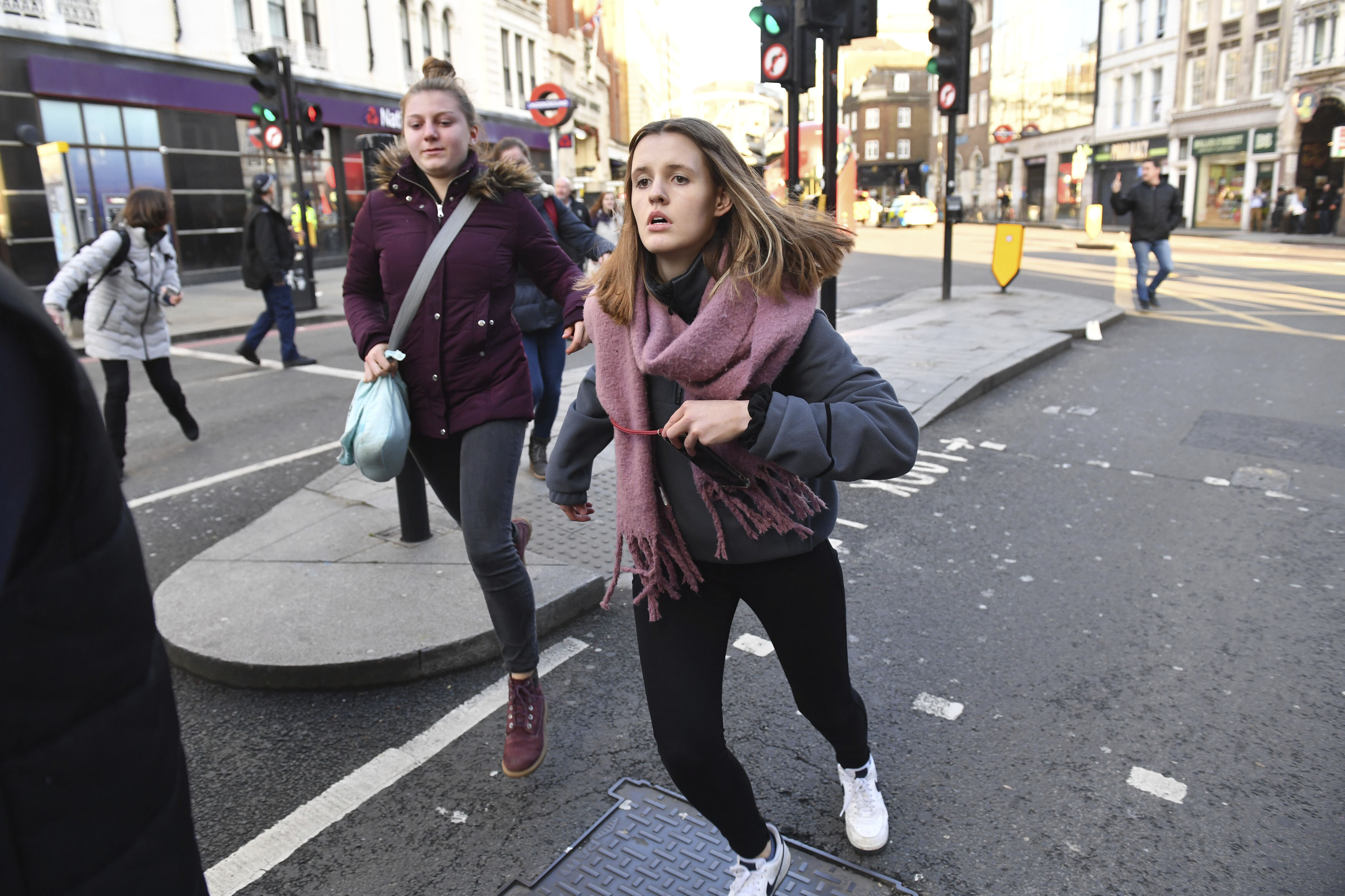 People are evacuated from London Bridge in central London following a police incident, on Friday.