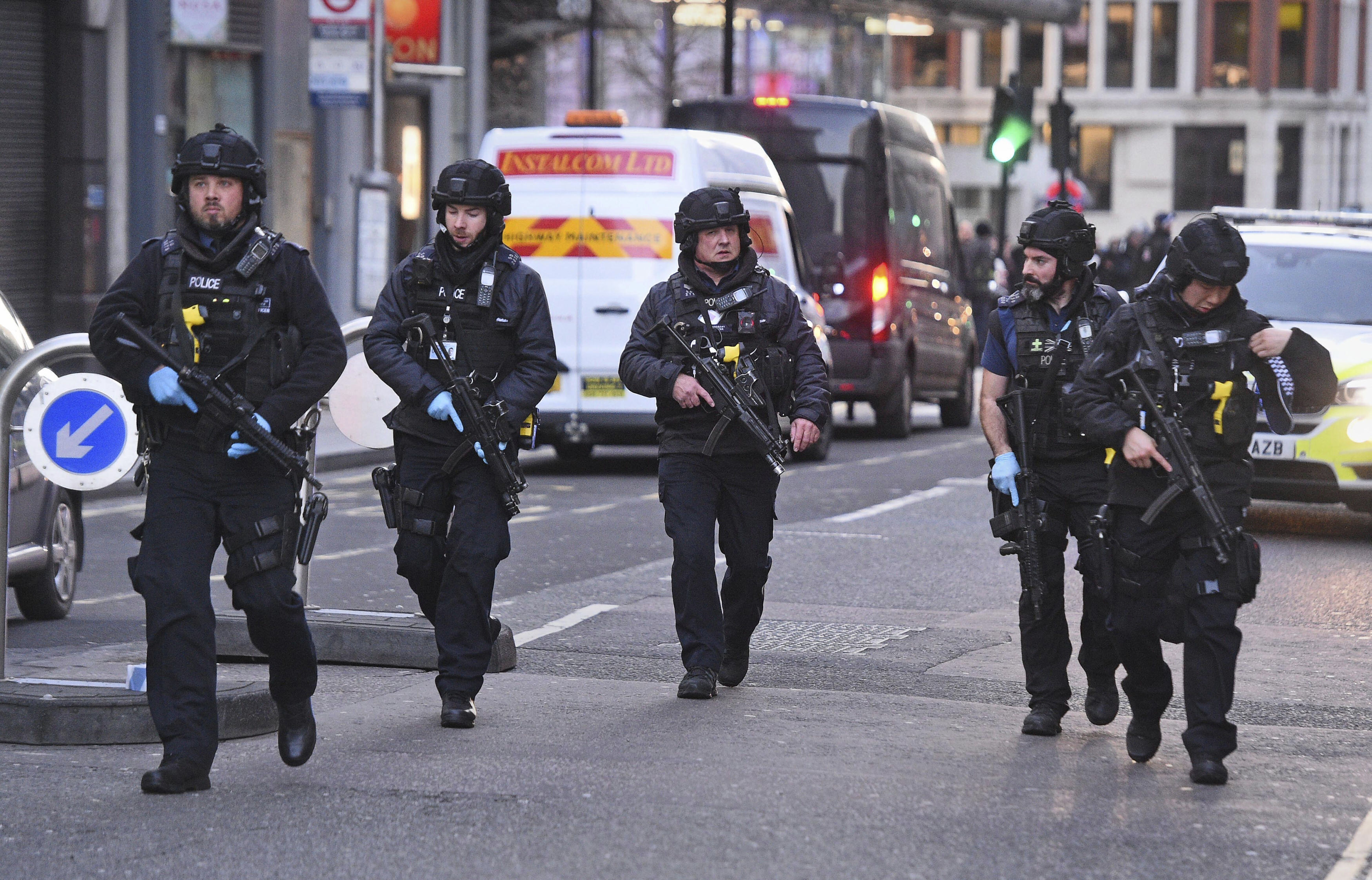 Police on Cannon Street in London near the scene of an incident on London Bridge in central London following a police incident, on Friday.