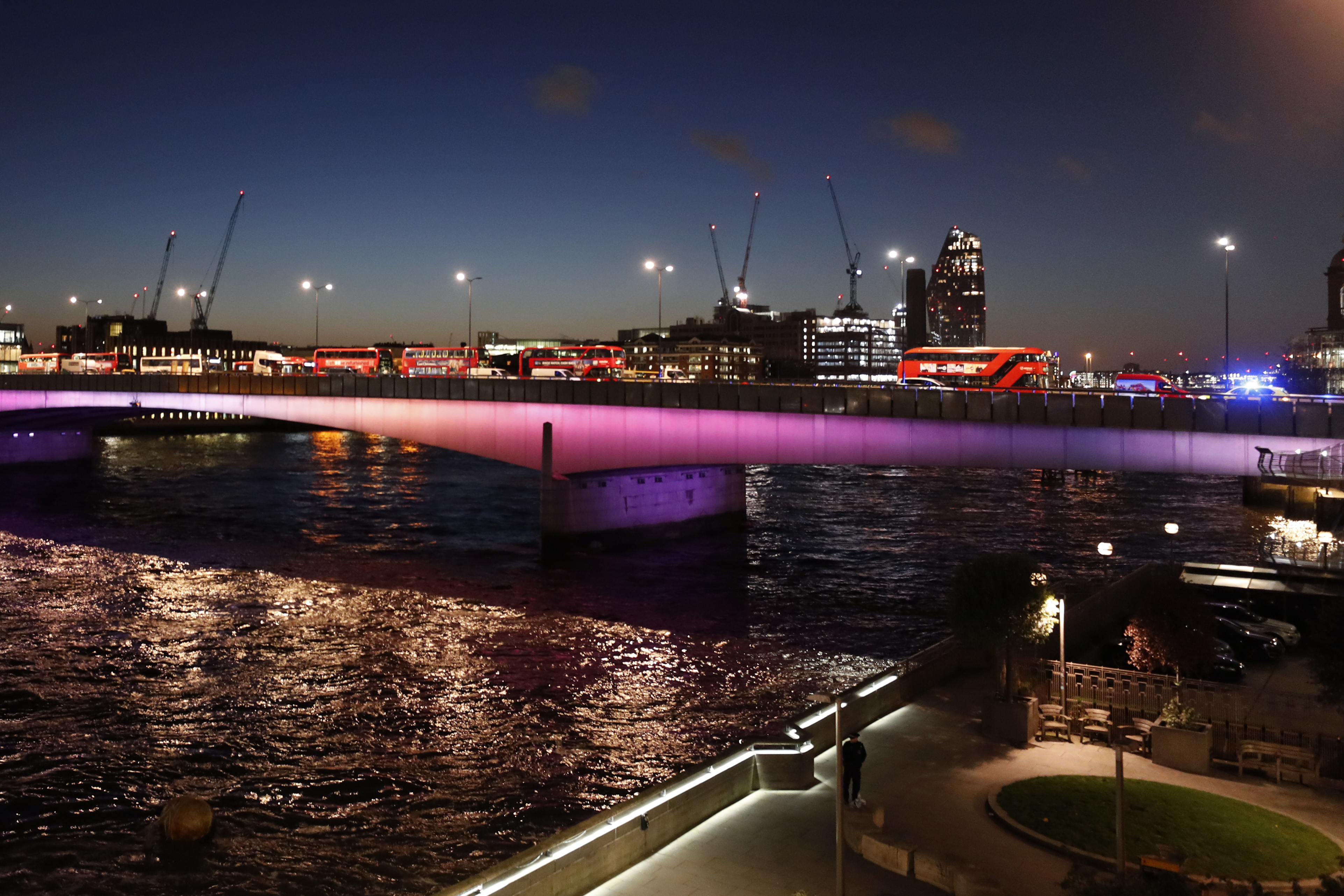 Abandoned buses and other vehicles are parked after an incident on London Bridge in London, on Friday.