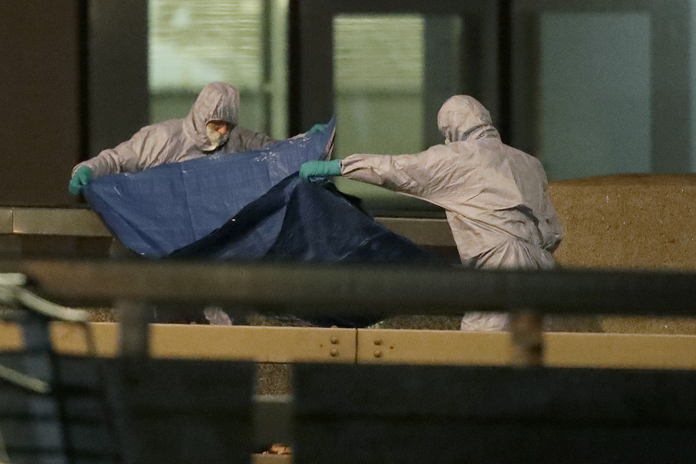 Police forensic officers work where a man was killed on London Bridge following an incident in London, on Friday.