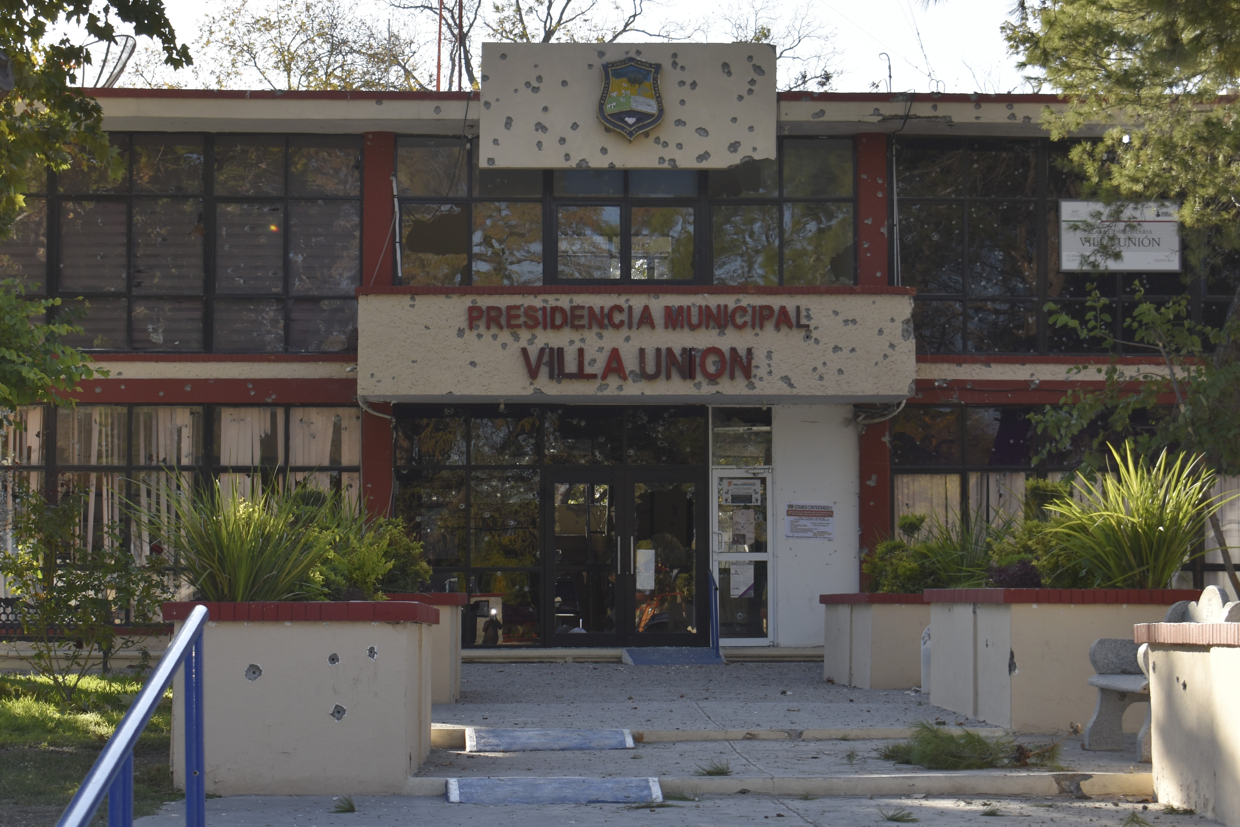 The City Hall of Villa Union is riddled with bullet holes after a gun battle between Mexican security forces and suspected cartel gunmen, on Saturday.