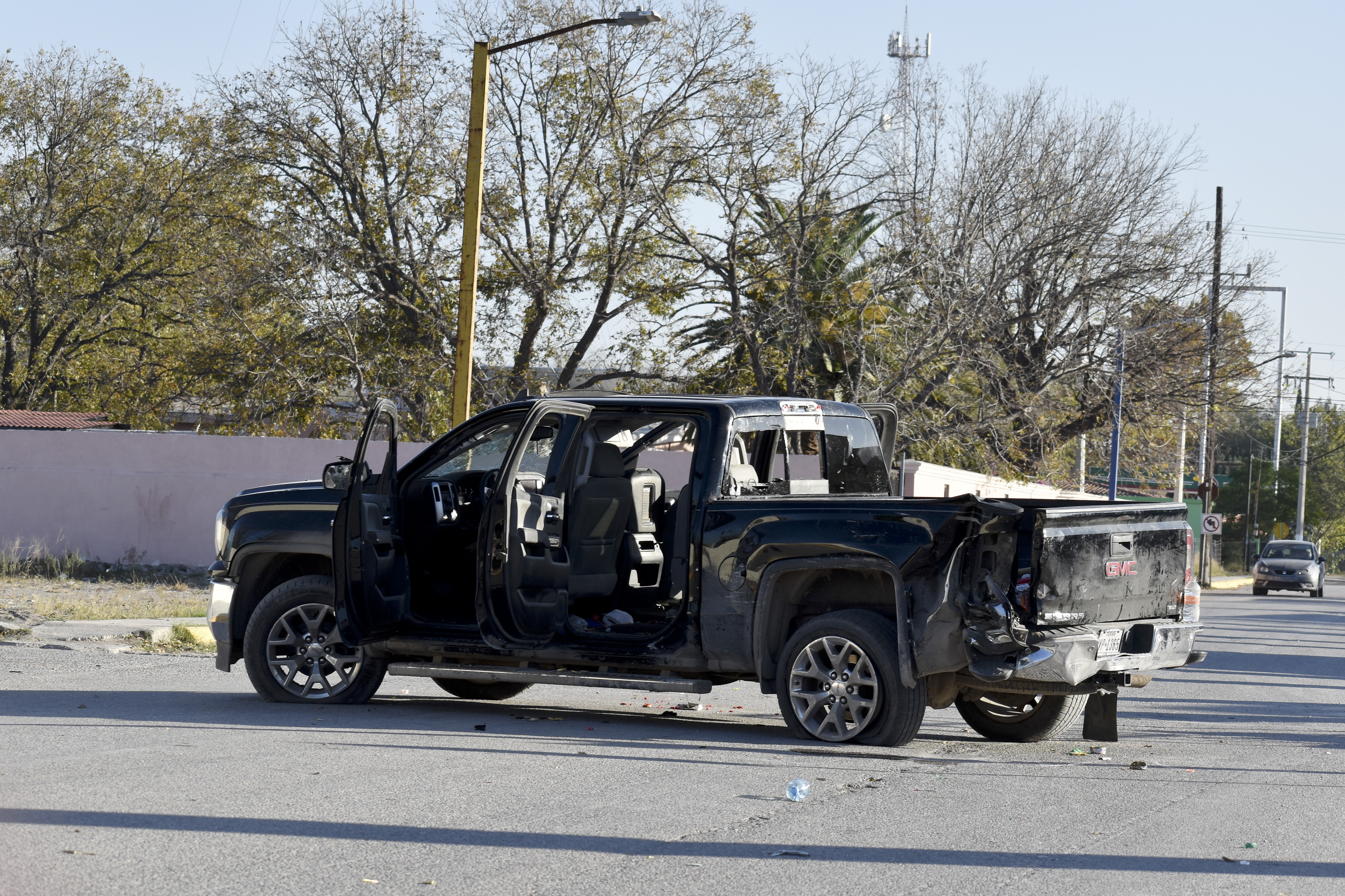 A damaged pick up is on the streets after a gun battle between Mexican security forces and suspected cartel gunmen, in Villa Union, Mexico, on Saturday.